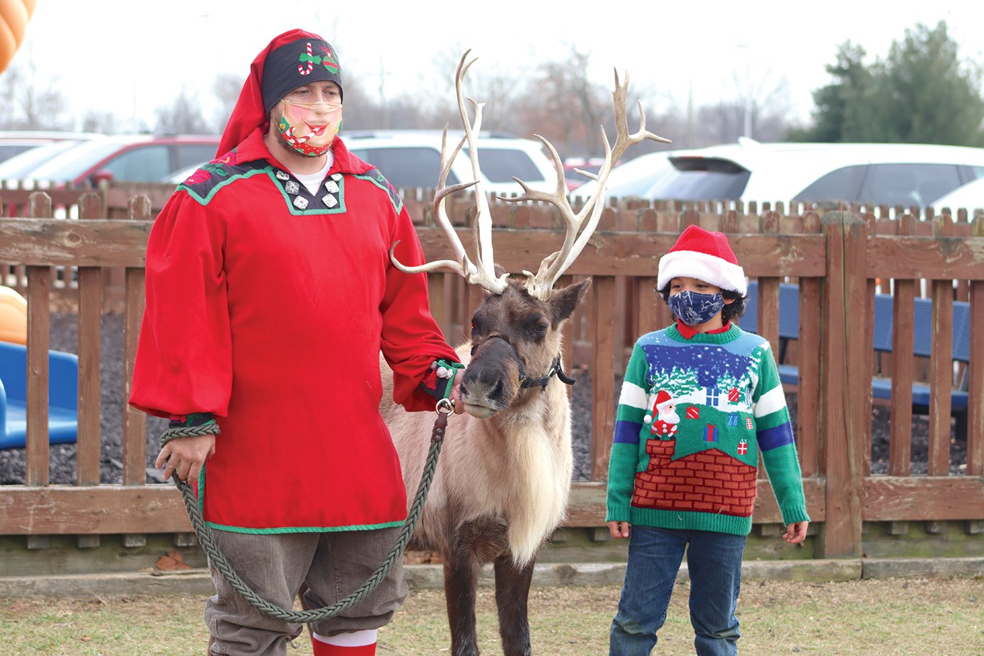 Silly Safaris' Candy Cane Chris and second grader Nicholas Gonzalez help students at Sommer Elementary learn about reindeer Friday afternoon during a miniature outdoor field trip to the North Pole.
